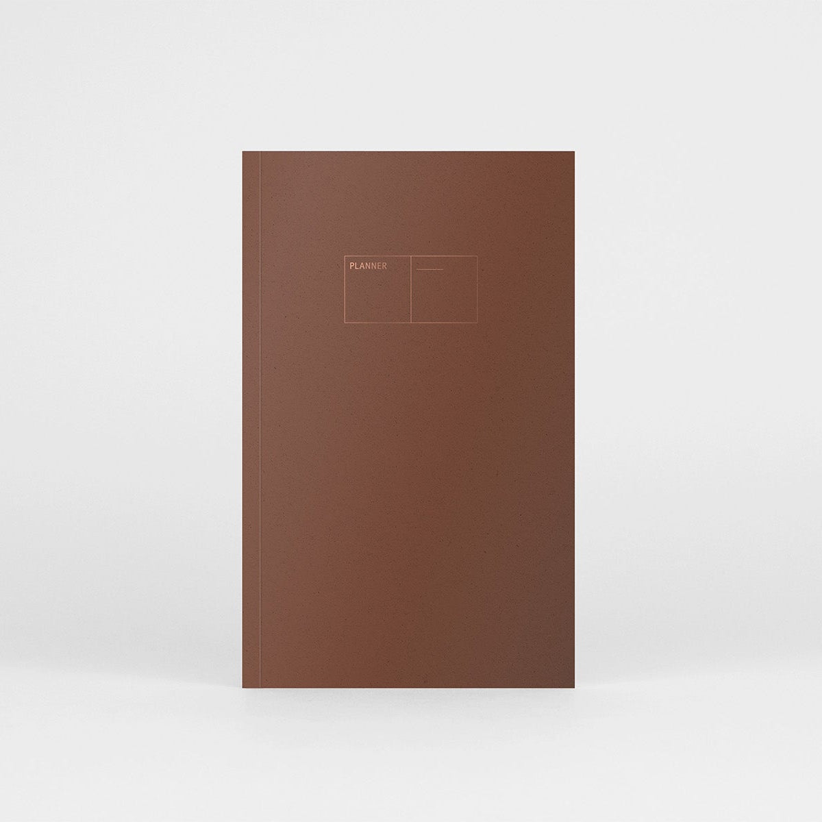 Planner niedatowany Copper w miękkiej oprawie w kolorze gliny z miedzianymi detalami.