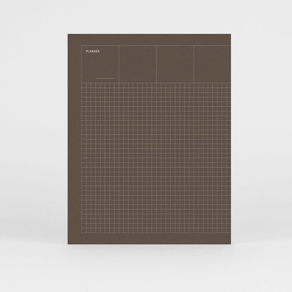 Planner niedatowany Grid w kolorze zielonym i z srebrnym wzorem w kratkę na okładce.