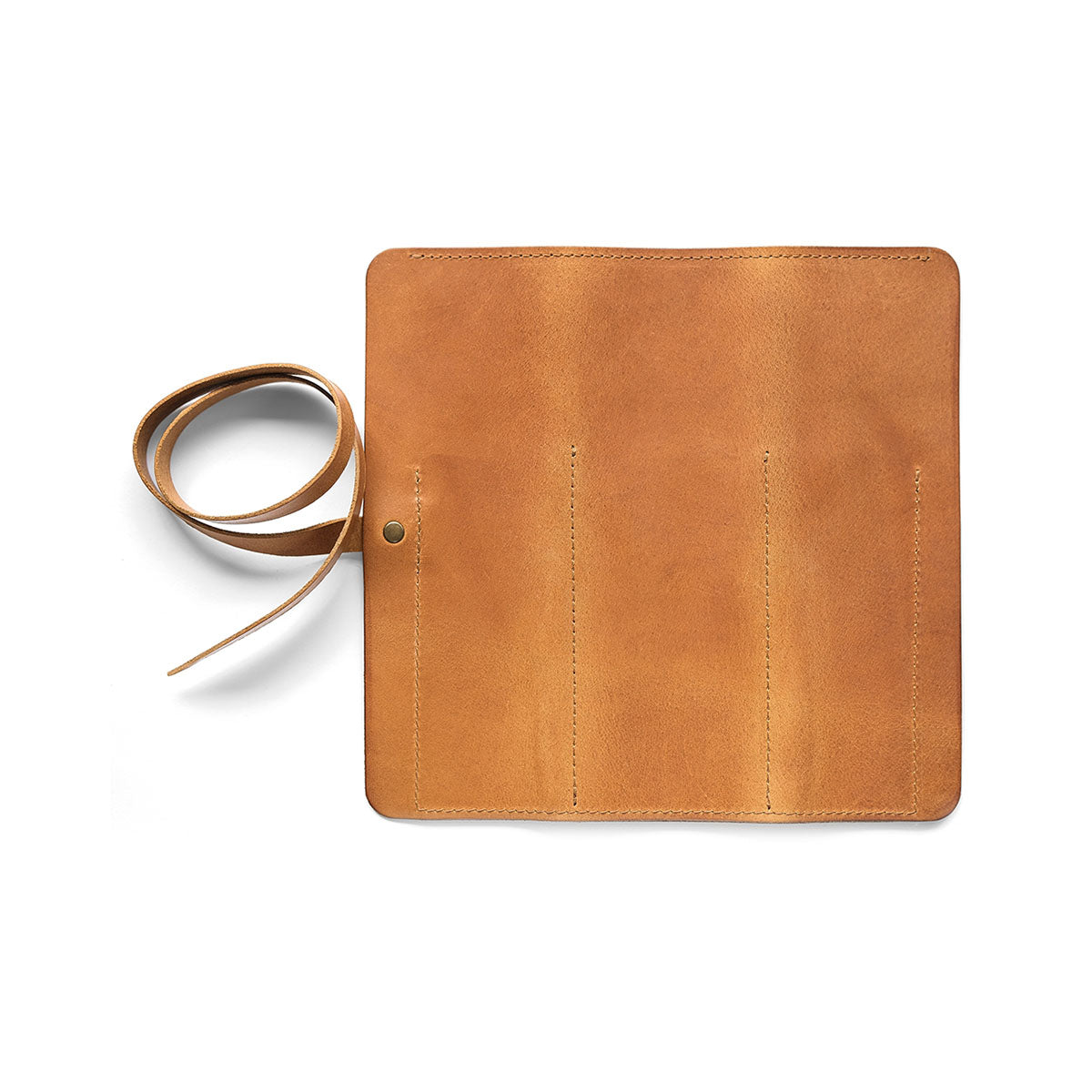 Skórzany piórnik rolowany – koniakowy, HUGBAG, papierniczy design