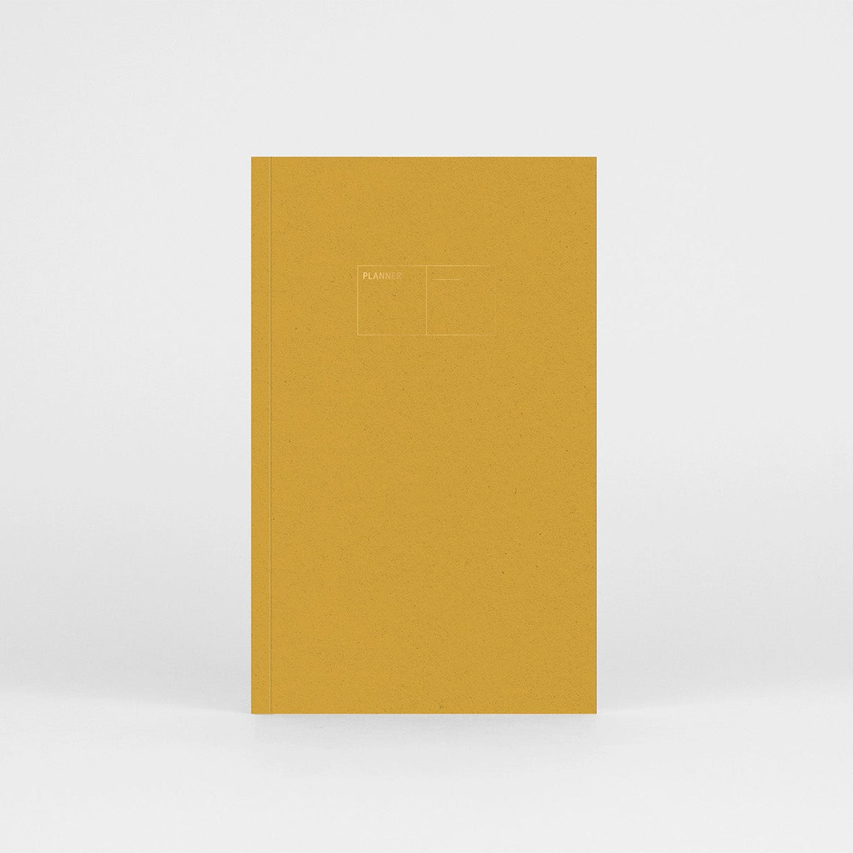 Planner niedatowany Copper w miękkiej oprawie w kolorze żółtym z miedzianymi detalami.